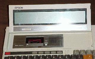 A close-up of the Geneva's small screen and microcassette tape drive.